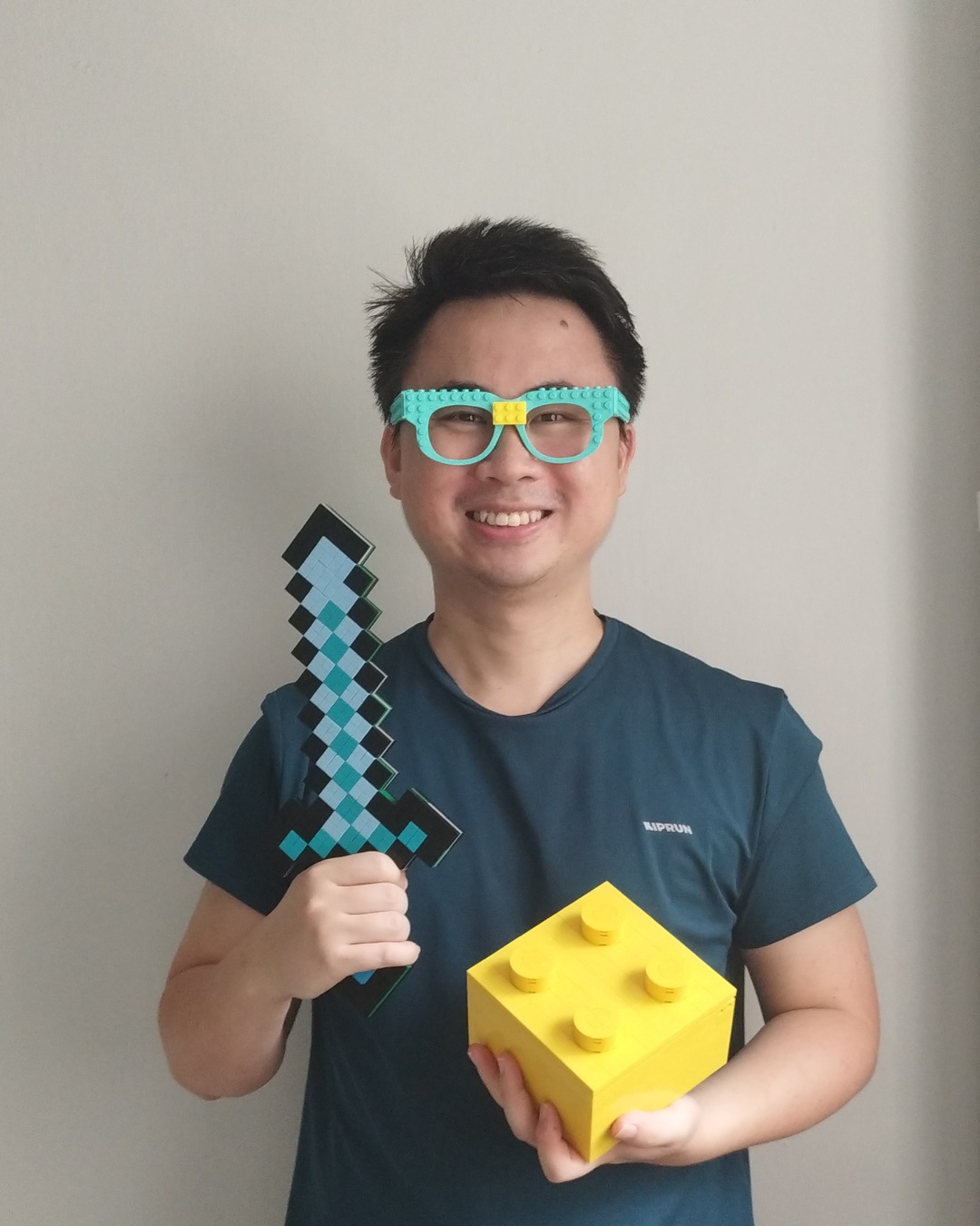 Kelvin, workshop lead, in teal brick glasses